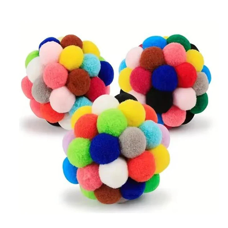 Colorful pom-pom ball toy on a white background