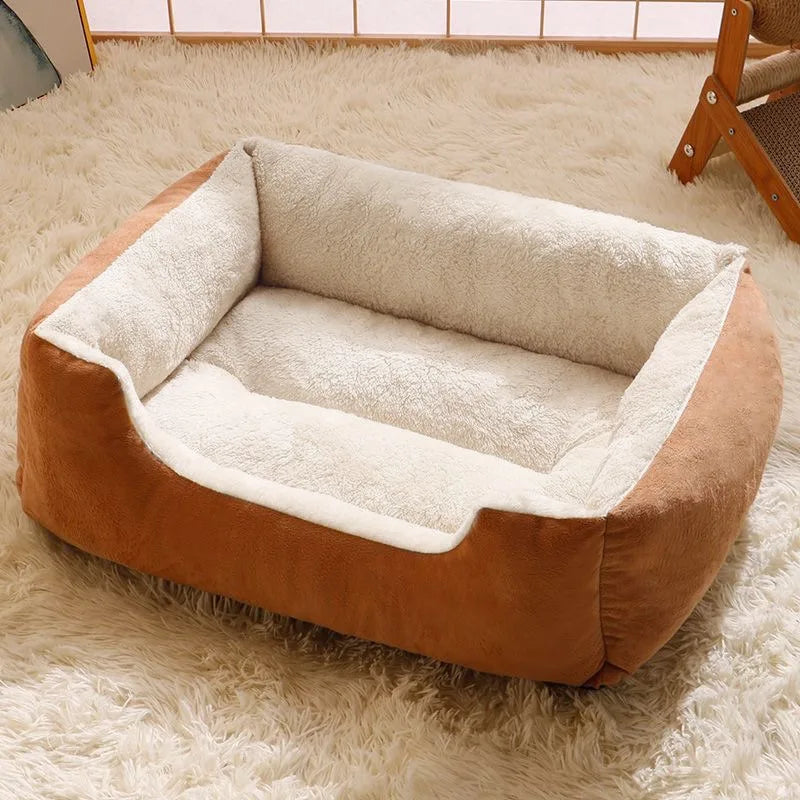 Brown and beige pet bed on a fluffy white carpet