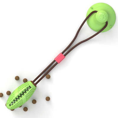 Dog toy with a green ball and brown handle on a white background
