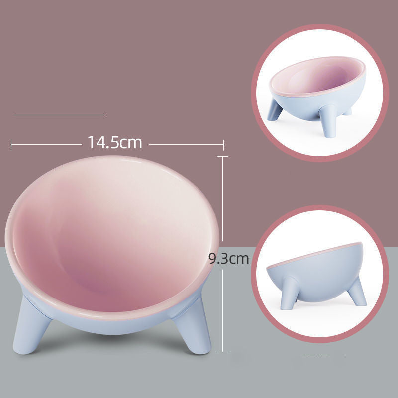 Pink and blue pet bowl with measurements on a gray background
