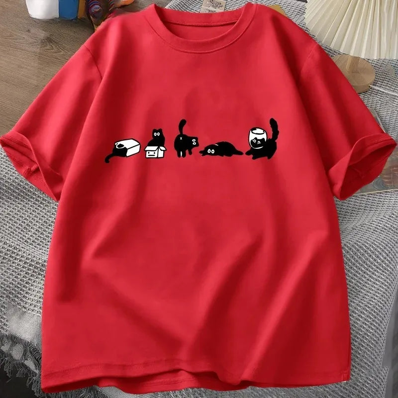 Red t-shirt with black cat illustrations on a textured surface