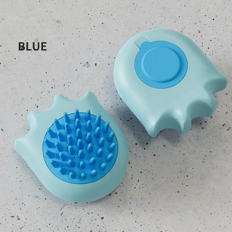 Two blue silicone pet grooming tools on a gray surface
