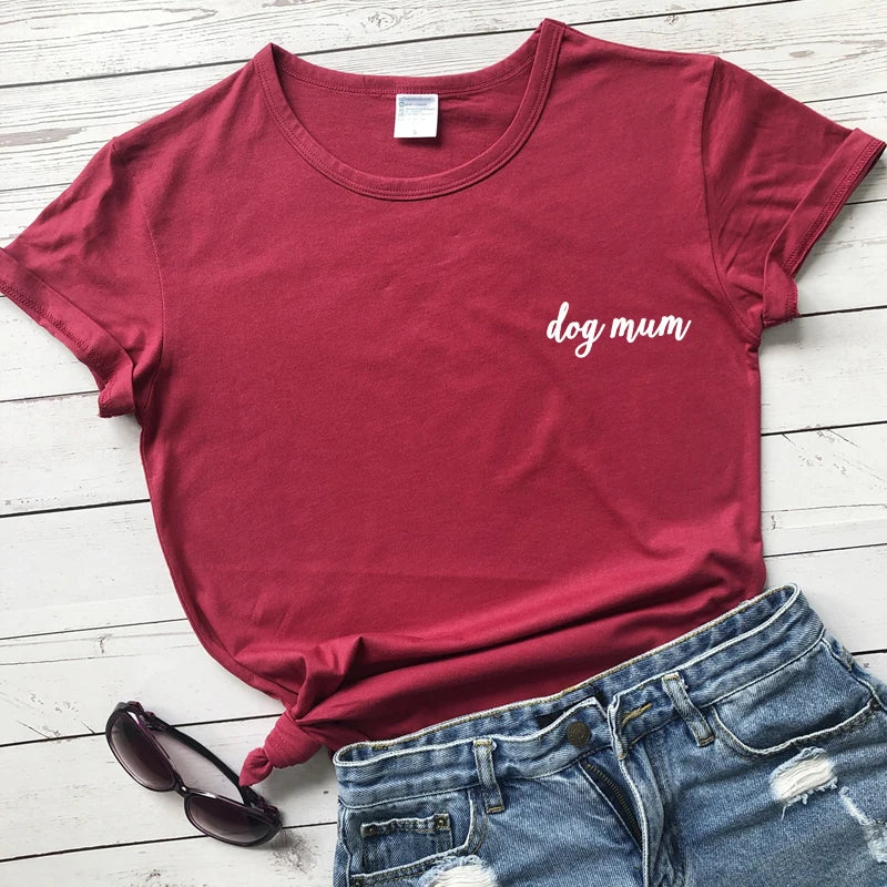 Red t-shirt with 'dog mum' text on a wooden floor with jeans and shoes.