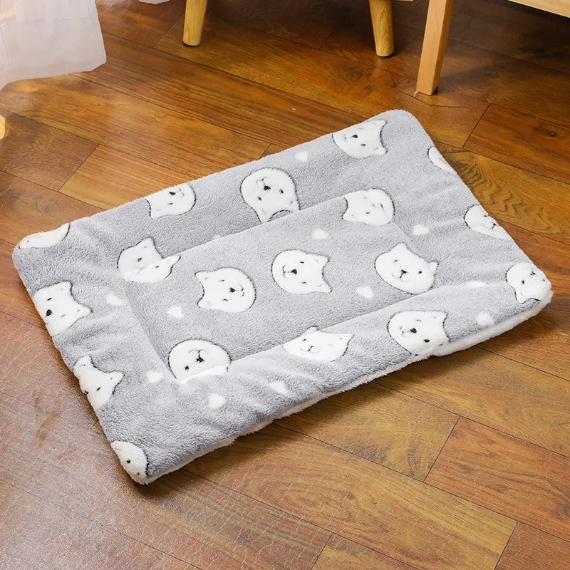 Gray rug with white bear pattern on a wooden floor