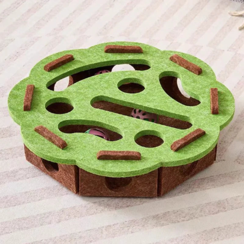 Green and brown puzzle toy for pets on a striped fabric background