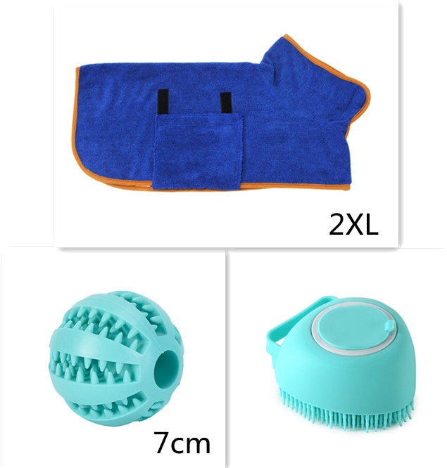 Blue pet towel with orange trim, blue rubber ball, and blue grooming brush on a white background