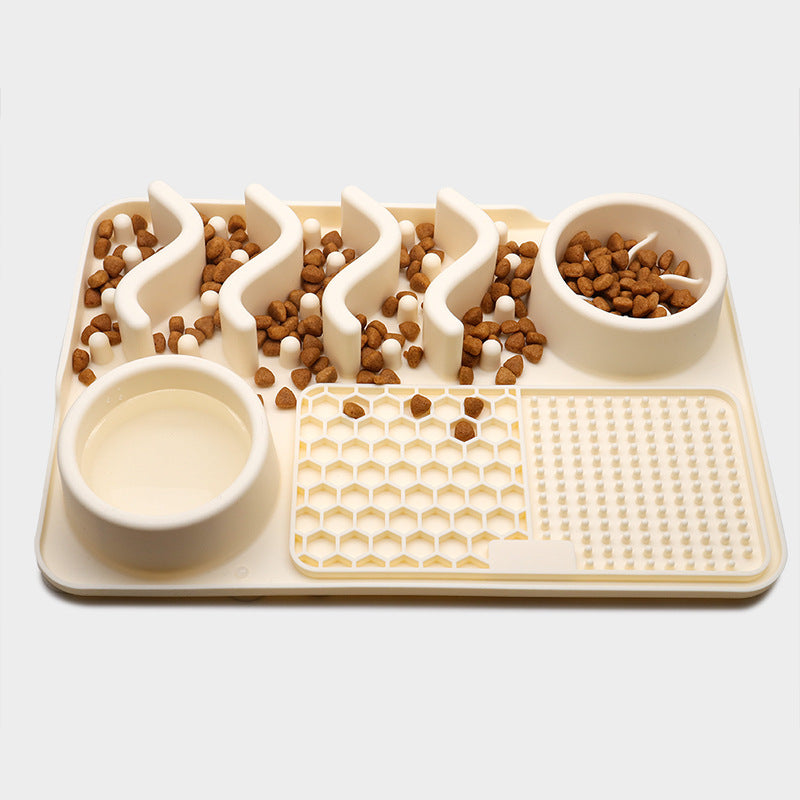 Pet puzzle feeder with food distribution on a white background