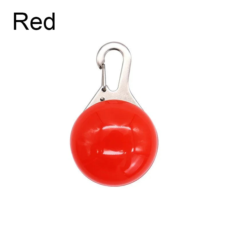 Red ball with a silver carabiner on a white background