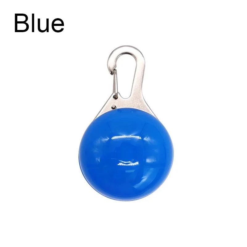 Blue round object with a metal clip on a white background