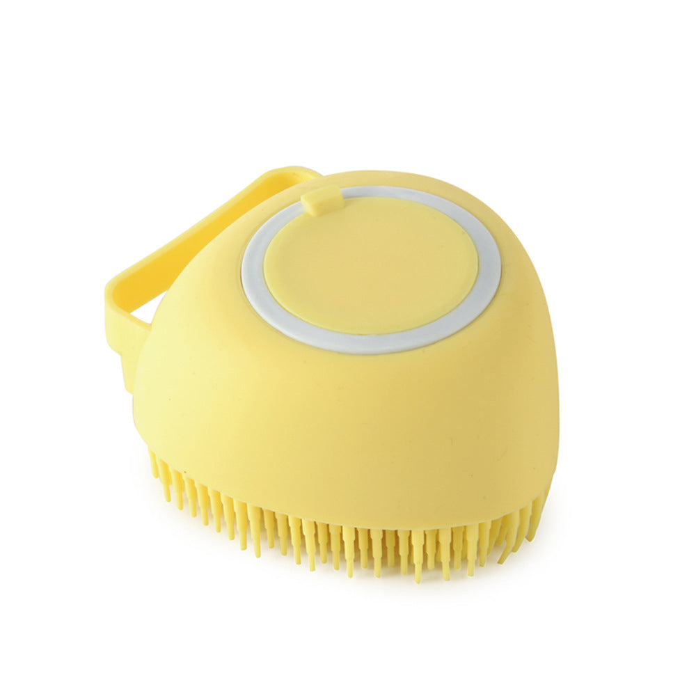 Yellow silicone scrubber with bristles on a white background