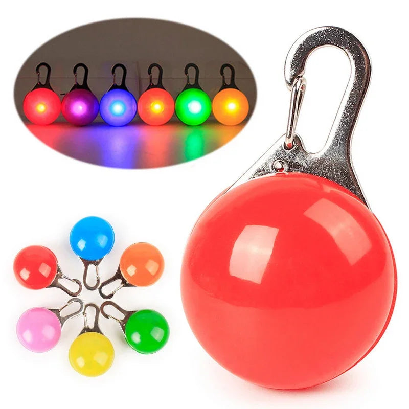 Colorful LED keychain lights with a carabiner on a white background