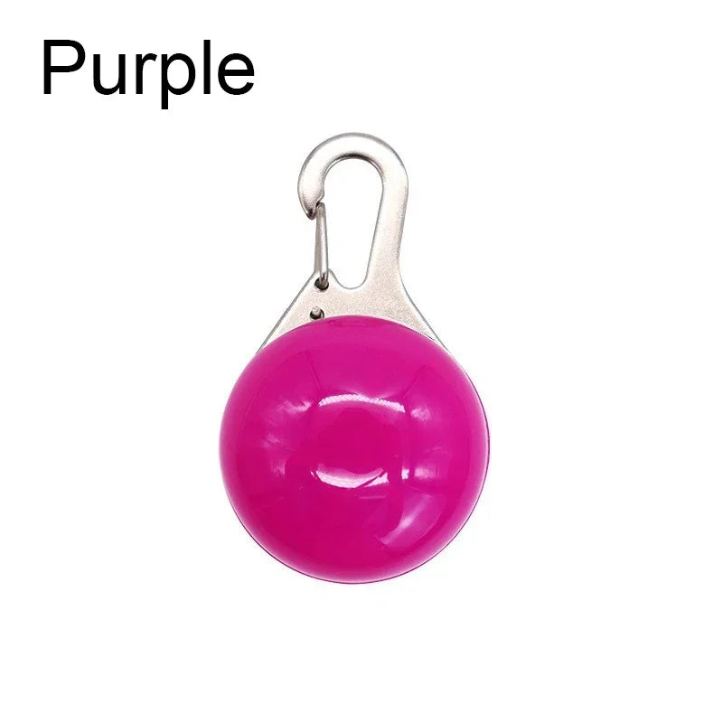 Purple round keychain with a silver clip on a white background