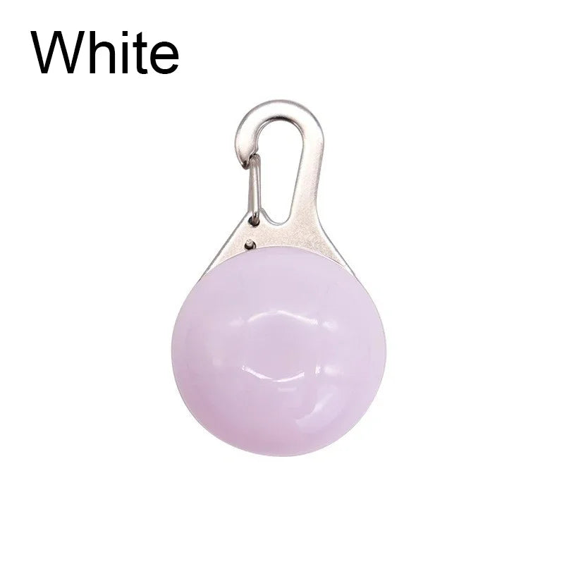 Pink ball keychain with a carabiner on a white background
