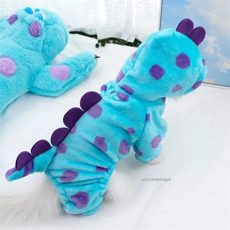 Blue and purple dinosaur-shaped plush toy on a white surface