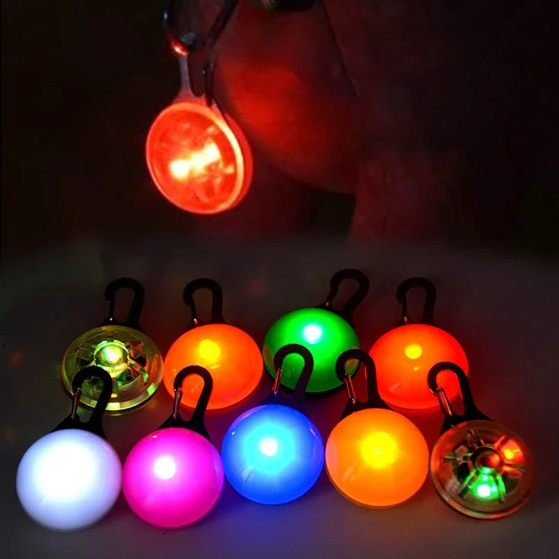 Colorful LED keychain lights on a dark background