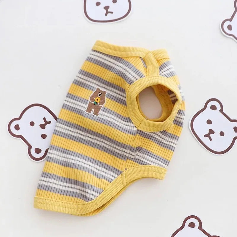 Striped pet vest with a bear design on a white background