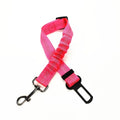 Pink dog leash with black clip and carabiner on a white background