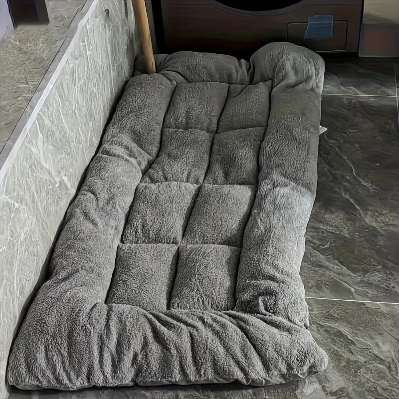Gray pet bed on a tiled floor