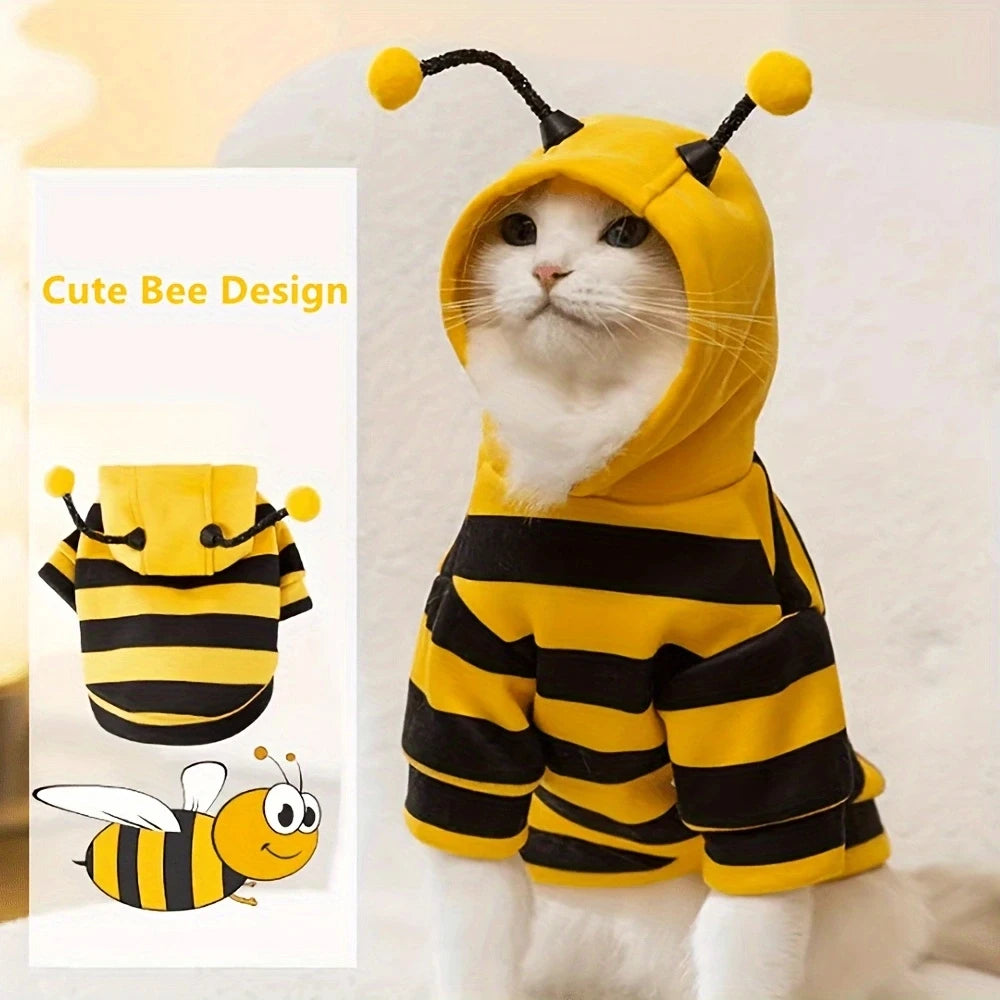 Cat wearing a bee-themed costume with a small inset showing the design.