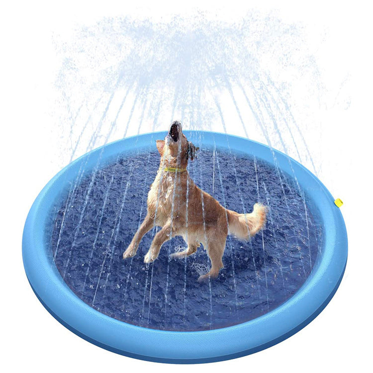 Dog playing on a blue inflatable sprinkler pad with water splashing around.