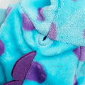 Close-up of a blue and purple textured fabric with floral patterns