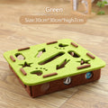 Green and brown puzzle toy on a wooden floor