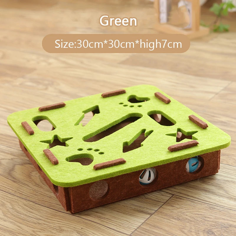 Green and brown puzzle toy on a wooden floor