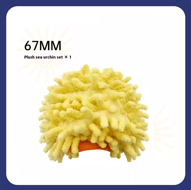 Plush sea urchin toy with '67MM' text on a white background