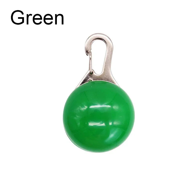 Green round pendant with a metal carabiner on a white background